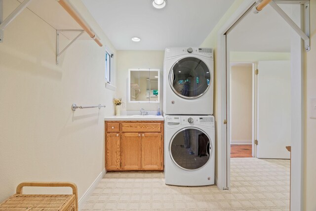 830 Willis St, Dassel, MN 55325 - laundry area with stacked washer and clothes dryer, recessed lighting, cabinet space, and light carpet