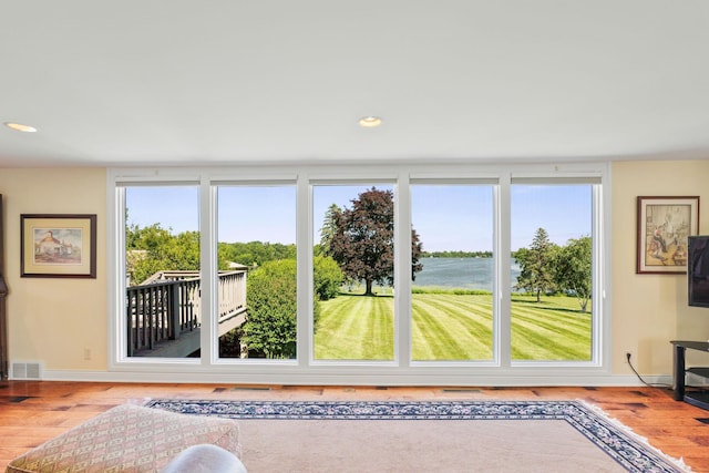 830 Willis St, Dassel, MN 55325 - living area featuring wood finished floors, plenty of natural light, and recessed lighting