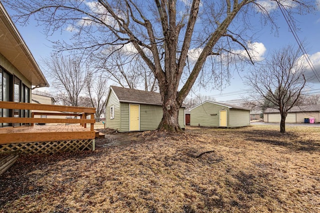 710 Jefferson St, New Ulm, MN 56073 - view of yard featuring a wooden deck and a storage unit