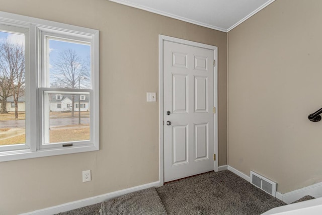 710 Jefferson St, New Ulm, MN 56073 - carpeted foyer with ornamental molding and baseboards
