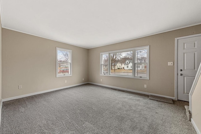 710 Jefferson St, New Ulm, MN 56073 - carpeted empty room featuring baseboards