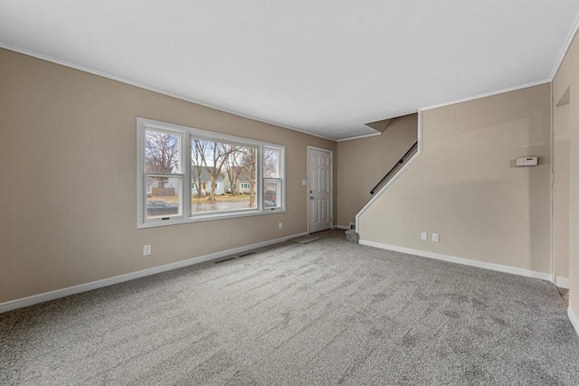 710 Jefferson St, New Ulm, MN 56073 - unfurnished living room featuring crown molding, carpet flooring, and stairs