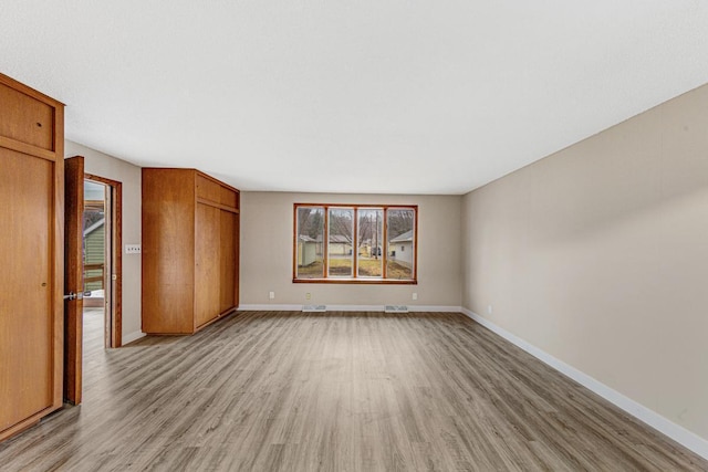 710 Jefferson St, New Ulm, MN 56073 - unfurnished bedroom featuring light wood-type flooring and a closet