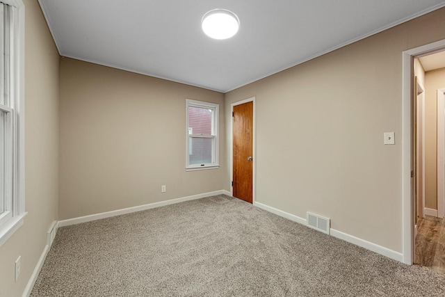 710 Jefferson St, New Ulm, MN 56073 - empty room with carpet flooring and baseboards