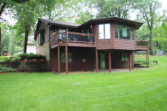 13445 190th Ave NW, Elk River, MN 55330 - rear view of house with a lawn, a patio, and a deck