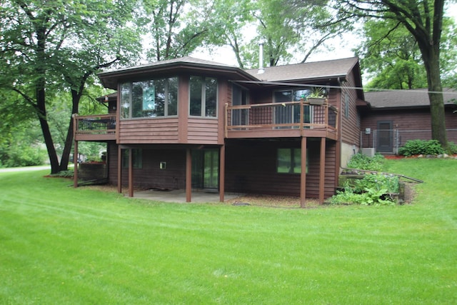 13445 190th Ave NW, Elk River, MN 55330 - rear view of property with a lawn, a patio, and a wooden deck