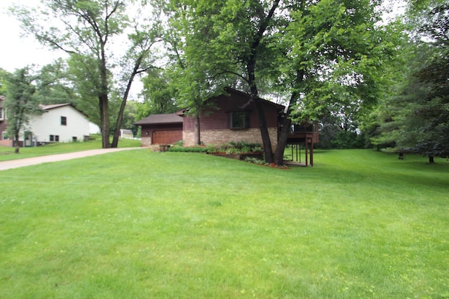 13445 190th Ave NW, Elk River, MN 55330 - view of green lawn with a garage and driveway