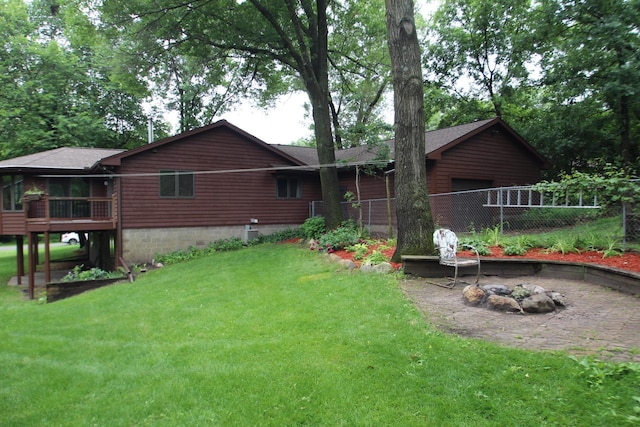 13445 190th Ave NW, Elk River, MN 55330 - back of property with a deck and roof with shingles