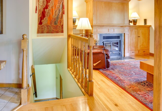 13445 190th Ave NW, Elk River, MN 55330 - staircase with a glass covered fireplace and baseboards