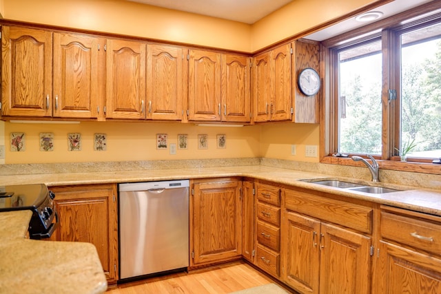 13445 190th Ave NW, Elk River, MN 55330 - kitchen with dishwasher, brown cabinetry, light countertops, black range with electric cooktop, and light wood-style floors