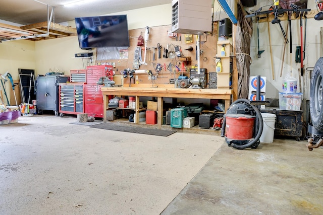 13445 190th Ave NW, Elk River, MN 55330 - garage with a workshop area and a heating unit