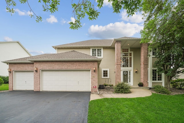 8017 Lismore Cir, Eden Prairie, MN 55347 - view of front of house with an attached garage, driveway, a front lawn, a shingled roof, and brick siding