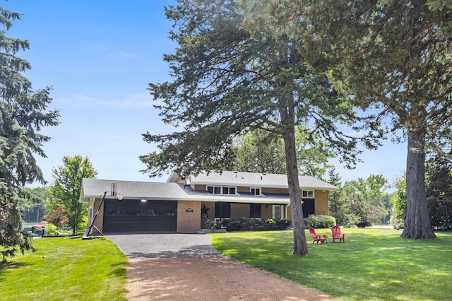12329 Timber Ln, Maple Grove, MN 55369 - view of front facade featuring a garage, driveway, a front yard, and brick siding