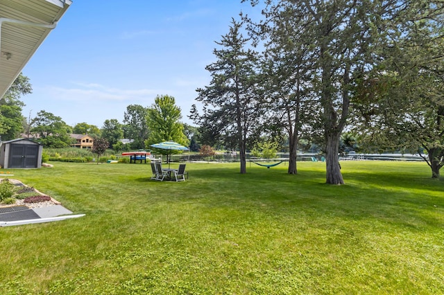 12329 Timber Ln, Maple Grove, MN 55369 - view of grassy yard featuring a storage shed