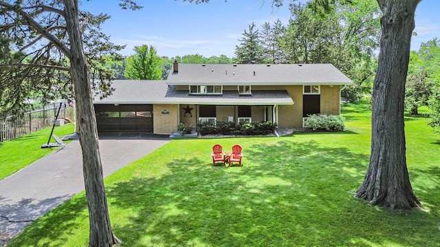 12329 Timber Ln, Maple Grove, MN 55369 - view of front of property featuring a garage, asphalt driveway, brick siding, and a shingled roof