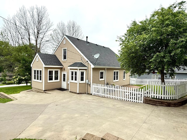 215 1st St N, Cannon Falls, MN 55009 - view of front of property with roof with shingles and a patio area