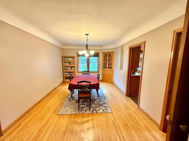 215 1st St N, Cannon Falls, MN 55009 - dining room with light wood-style flooring and a chandelier