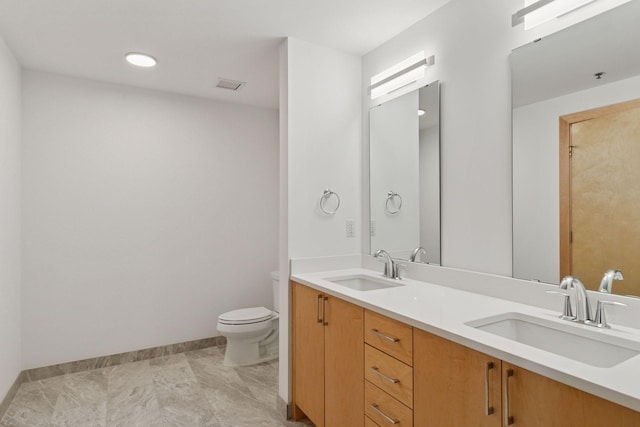 1240 2nd St Unit 1024, Minneapolis, MN 55415 - bathroom featuring toilet and double vanity