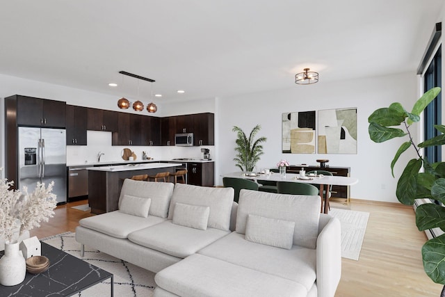 1240 2nd St Unit 1024, Minneapolis, MN 55415 - living area featuring light wood-style flooring and recessed lighting