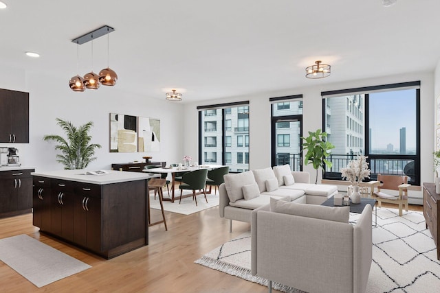 1240 2nd St Unit 1024, Minneapolis, MN 55415 - living area featuring plenty of natural light, light wood-type flooring, a chandelier, and recessed lighting