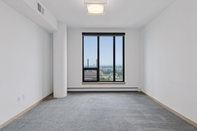 1240 2nd St Unit 1024, Minneapolis, MN 55415 - unfurnished room featuring carpet floors and a baseboard heating unit