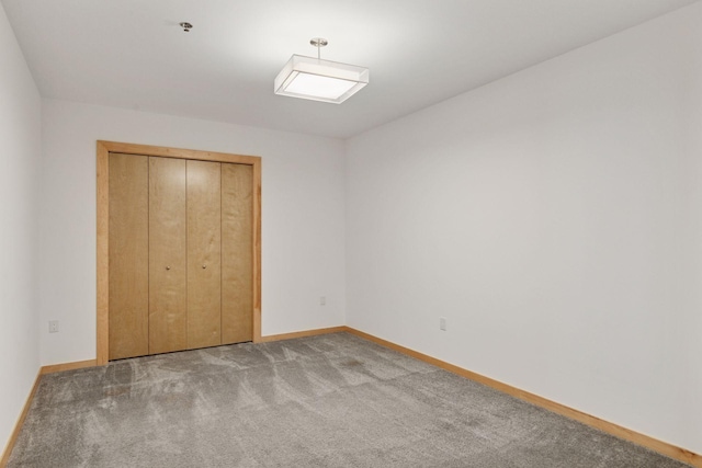 1240 2nd St Unit 1024, Minneapolis, MN 55415 - unfurnished bedroom with carpet flooring and a closet