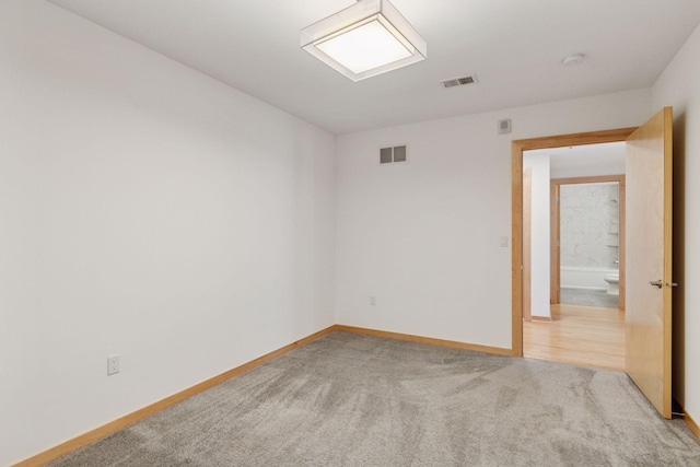 1240 2nd St Unit 1024, Minneapolis, MN 55415 - carpeted empty room with baseboards and a smoke detector