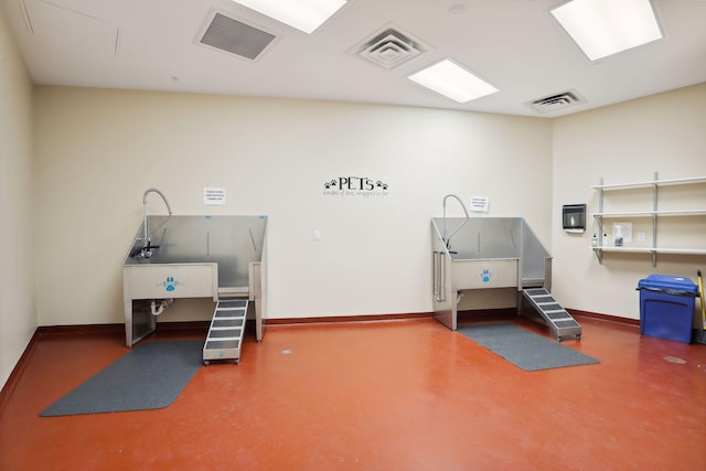 1240 2nd St Unit 1024, Minneapolis, MN 55415 - miscellaneous room with pet washing station and concrete floors