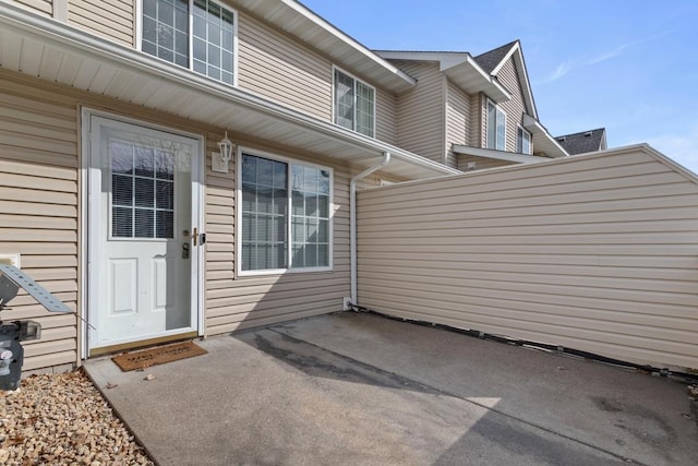 10787 Unity Ln N, Brooklyn Park, MN 55443 - view of exterior entry with a patio