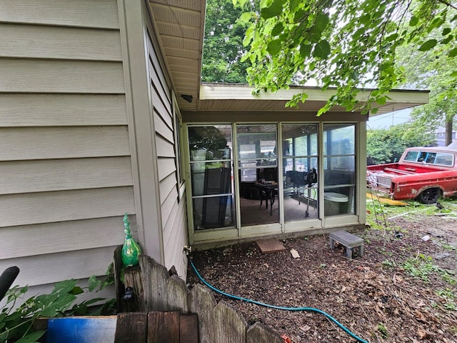 216 Hobart St, Owatonna, MN 55060 - view of home's exterior with a sunroom
