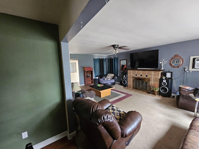216 Hobart St, Owatonna, MN 55060 - living area with a ceiling fan, a tiled fireplace, and an AC wall unit