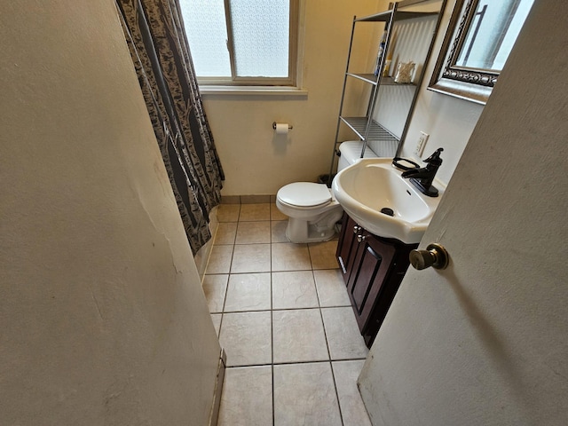 216 Hobart St, Owatonna, MN 55060 - full bath with plenty of natural light, tile patterned floors, and vanity