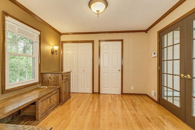 989 Kadler Ave NE, Saint Michael, MN 55376 - entryway with light wood finished floors, french doors, and ornamental molding