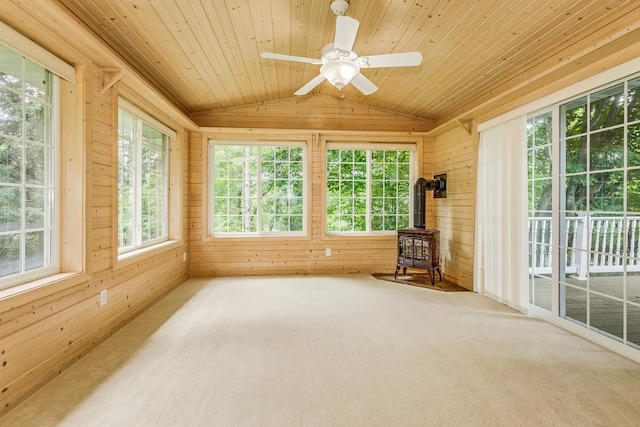 989 Kadler Ave NE, Saint Michael, MN 55376 - unfurnished sunroom featuring a wood stove, vaulted ceiling, wooden walls, carpet floors, and wooden ceiling