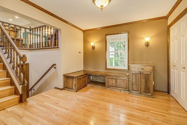 989 Kadler Ave NE, Saint Michael, MN 55376 - entrance foyer featuring light wood finished floors, crown molding, and stairway