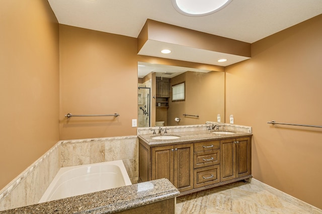 989 Kadler Ave NE, Saint Michael, MN 55376 - bathroom with a bath, double vanity, a shower, and recessed lighting