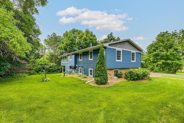 989 Kadler Ave NE, Saint Michael, MN 55376 - view of home's exterior with a yard