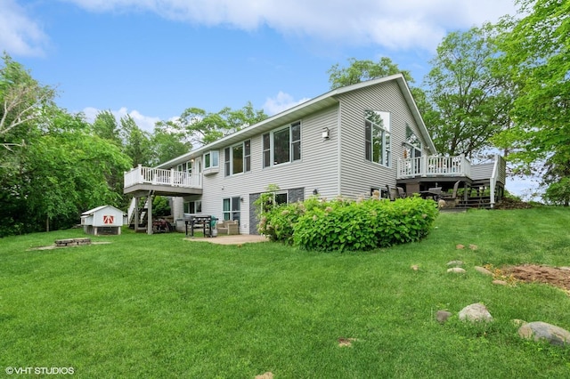 1837 Liberty St, Mora, MN 55051 - back of house with a deck, a lawn, a shed, and a patio