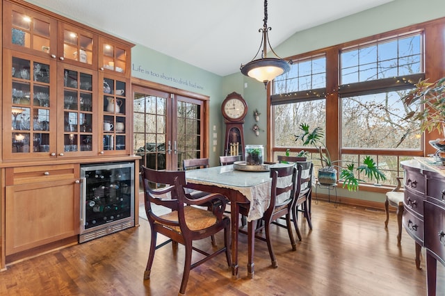 12322 Coffee Trl, Rosemount, MN 55068 - dining room featuring wine cooler, vaulted ceiling, and dark wood-type flooring