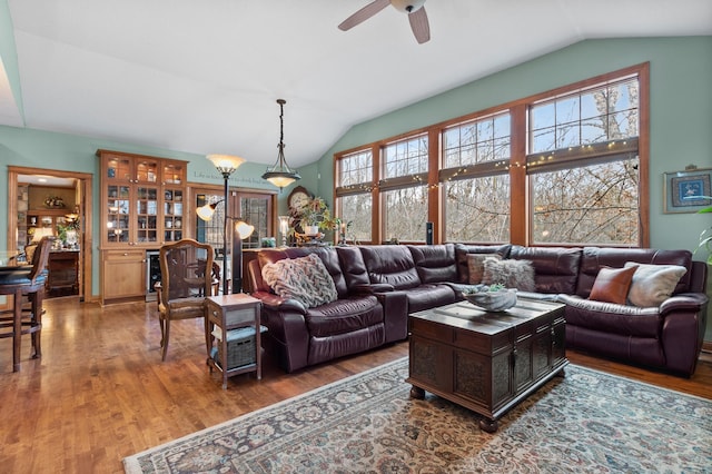 12322 Coffee Trl, Rosemount, MN 55068 - living room featuring vaulted ceiling, wood finished floors, and ceiling fan