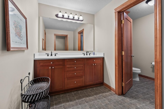 12322 Coffee Trl, Rosemount, MN 55068 - full bathroom with double vanity and a textured ceiling