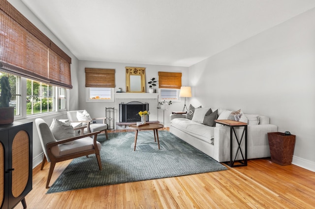 4633 Ewing Ave N, Robbinsdale, MN 55422 - living room with wood finished floors and a brick fireplace