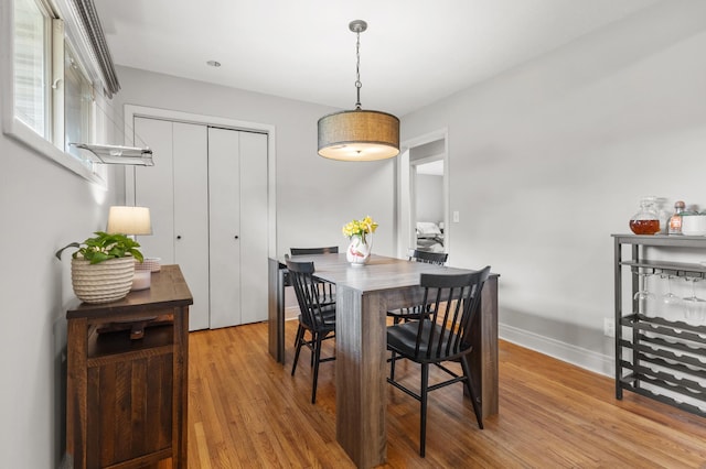 4633 Ewing Ave N, Robbinsdale, MN 55422 - dining area featuring wood finished floors and baseboards