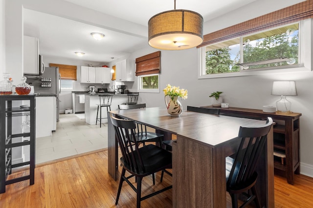 4633 Ewing Ave N, Robbinsdale, MN 55422 - dining area with light wood-style flooring
