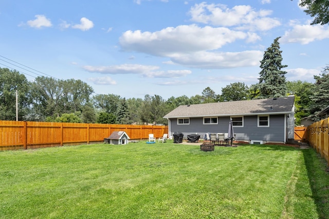 4633 Ewing Ave N, Robbinsdale, MN 55422 - rear view of property with a fenced backyard and an outdoor fire pit