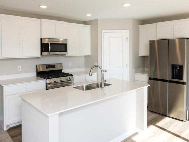 3214 Kady Ave NE, Saint Michael, MN 55376 - kitchen featuring stainless steel appliances, light wood-type flooring, white cabinetry, and recessed lighting