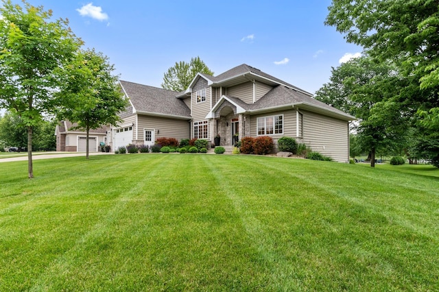 4326 Donway Dr NE, Alexandria, MN 56308 - traditional-style house featuring an attached garage, a front yard, roof with shingles, and driveway