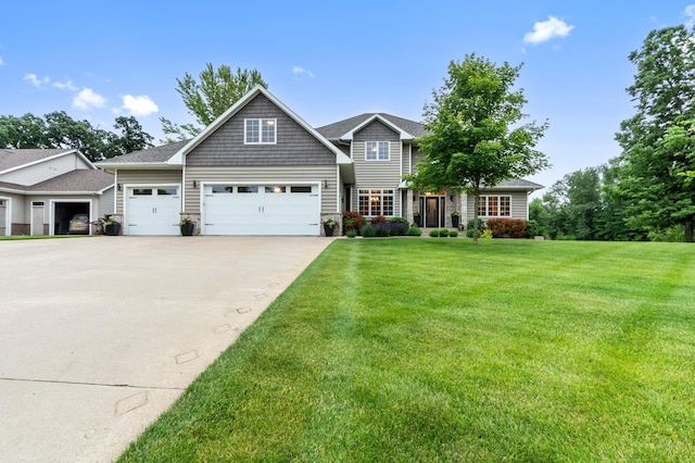 4326 Donway Dr NE, Alexandria, MN 56308 - view of front of property featuring an attached garage, concrete driveway, a front lawn, and stone siding