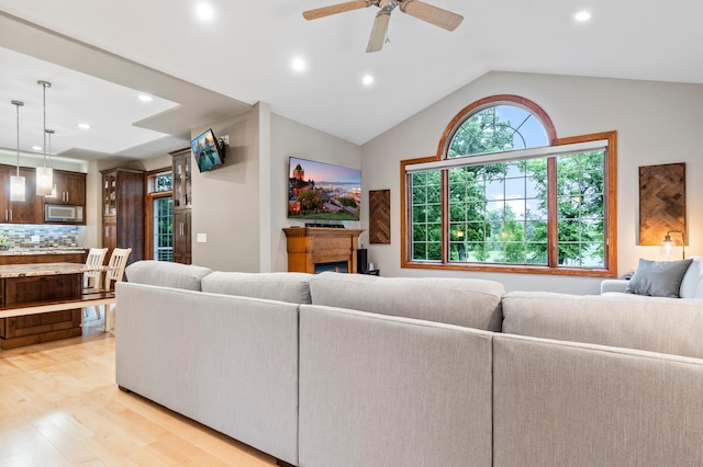 4326 Donway Dr NE, Alexandria, MN 56308 - living area with light wood-type flooring, recessed lighting, vaulted ceiling, ceiling fan, and a fireplace