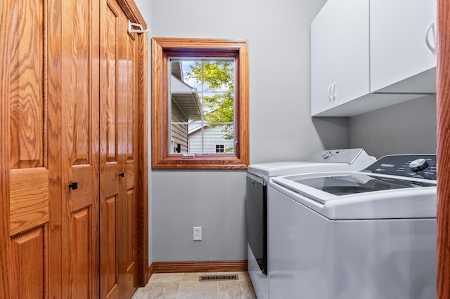 4326 Donway Dr NE, Alexandria, MN 56308 - laundry room featuring washing machine and clothes dryer and cabinet space